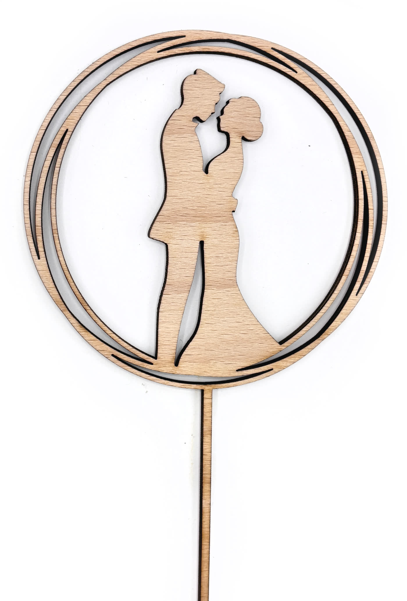 Wooden wedding cake topper: a couple's silhouette inside a cut ring, on a spike